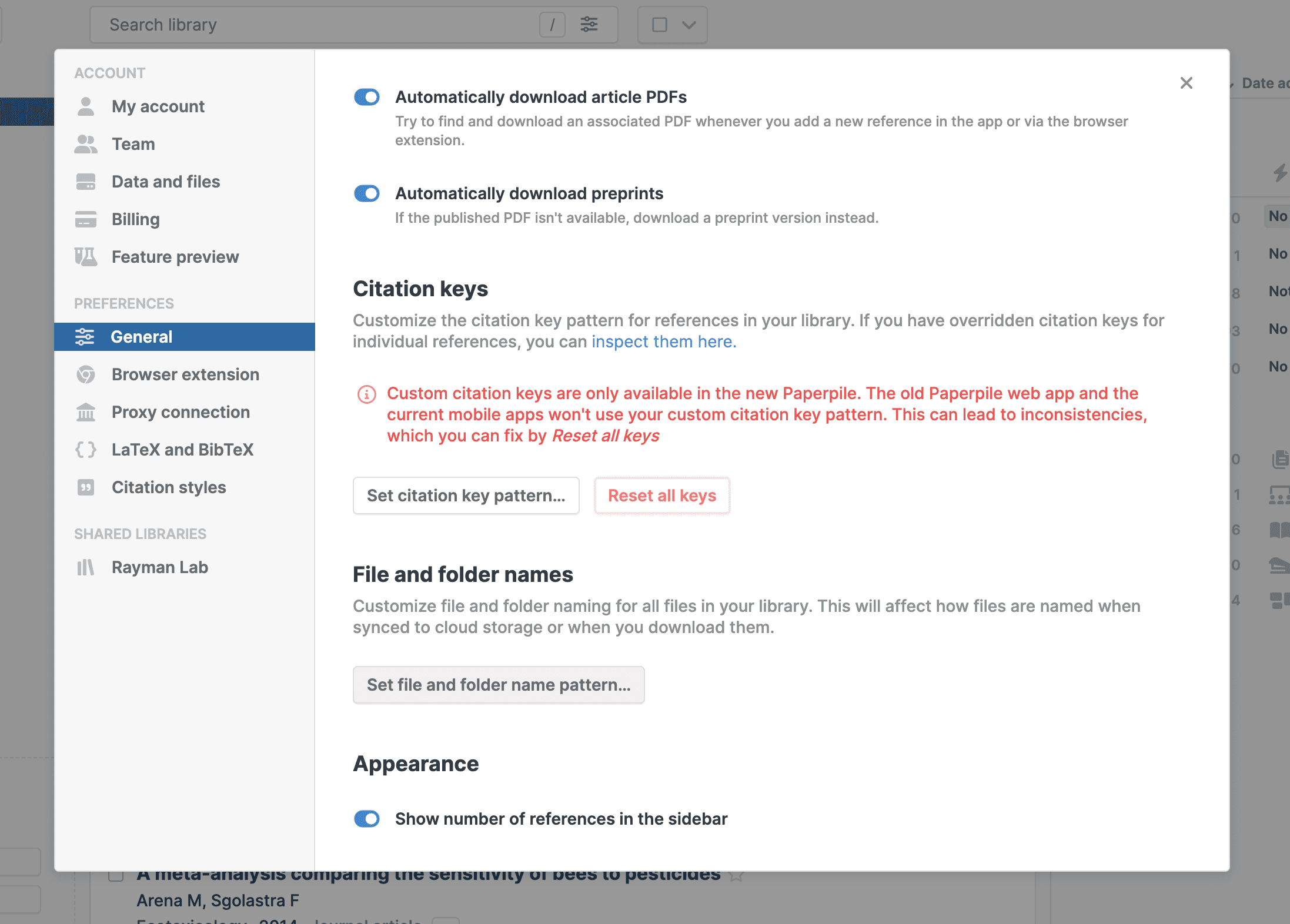 Settings › General with Automatically download article PDFs and preprints switched on, a Citation keys section warning that custom keys work only in the new Paperpile, and buttons to set the citation key and file and folder name patterns.